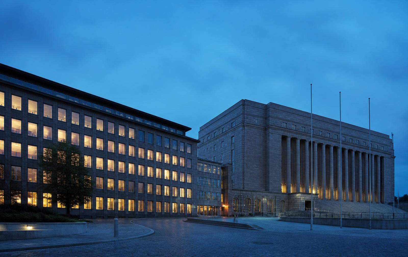 Nordic government administrative building exterior at dusk