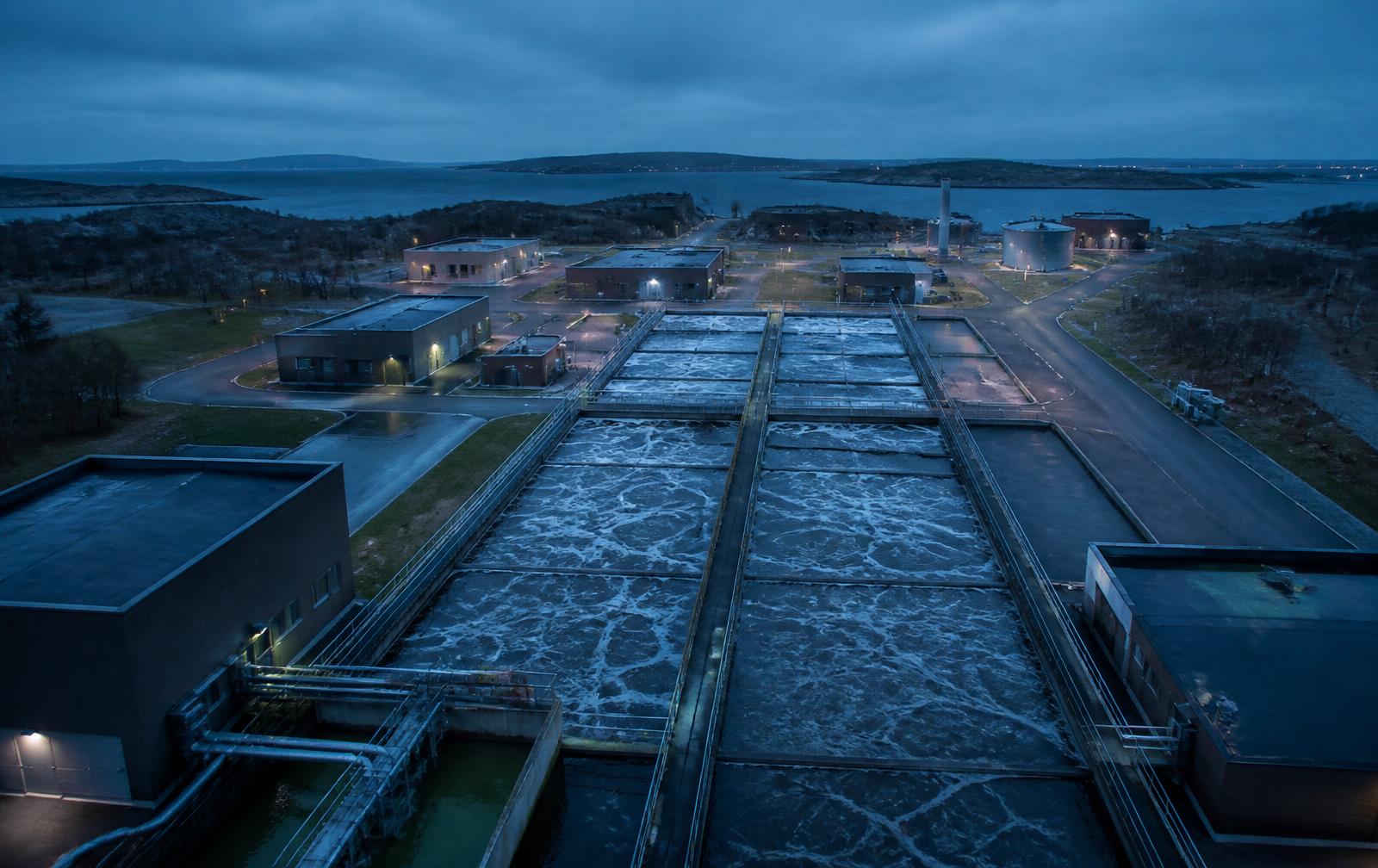 Wastewater treatment plant with rectangular aeration tanks at blue hour